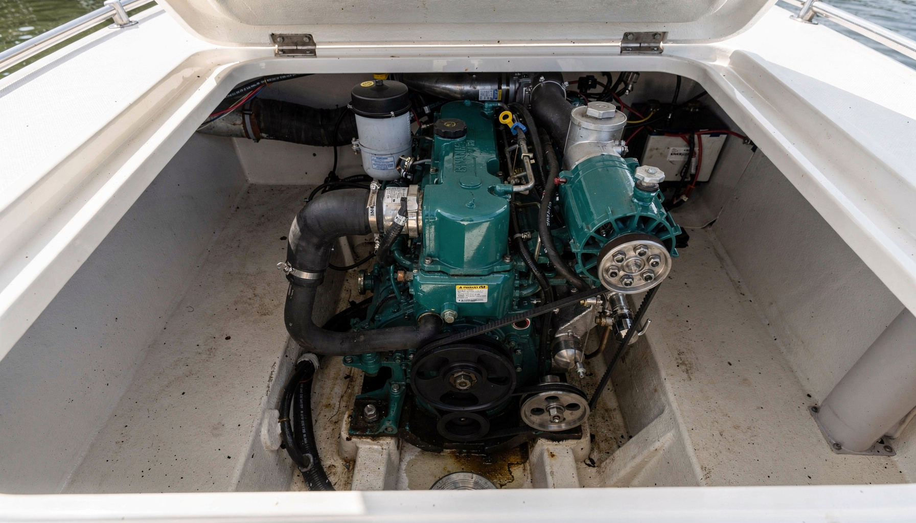 A marine diesel inboard engine in an open engine compartment, the system a mechanical survey examines in depth