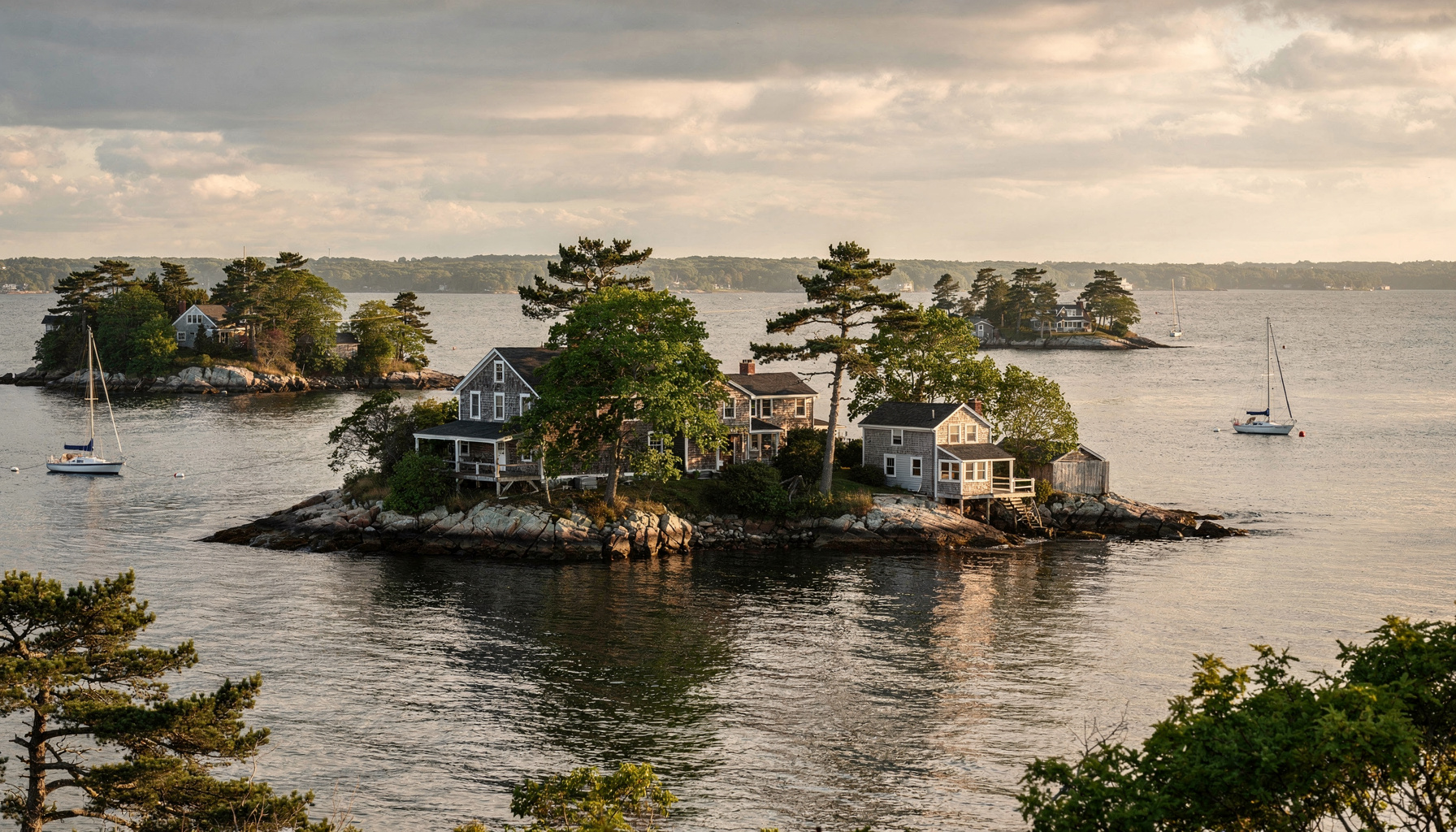 The Thimble Islands off Branford: small rocky, tree-covered islands with boats on moorings in Long Island Sound